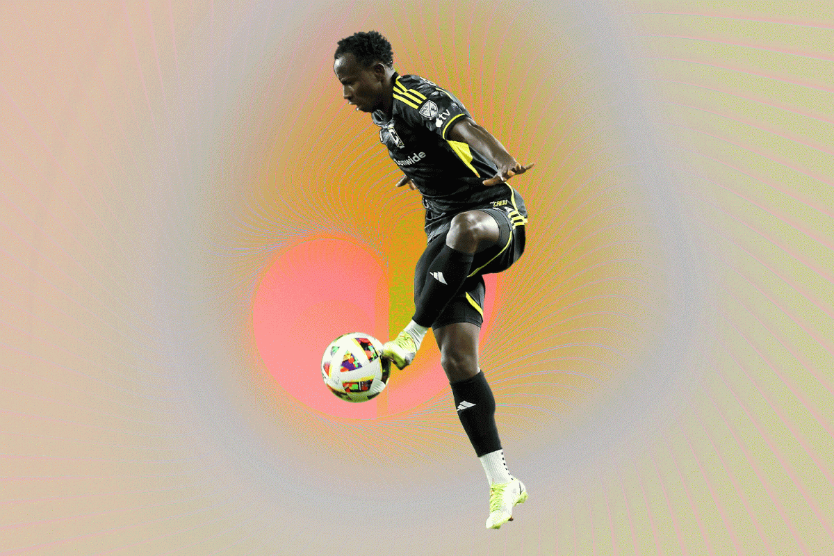 A Columbus Crew player kicking a ball against a trippy background.