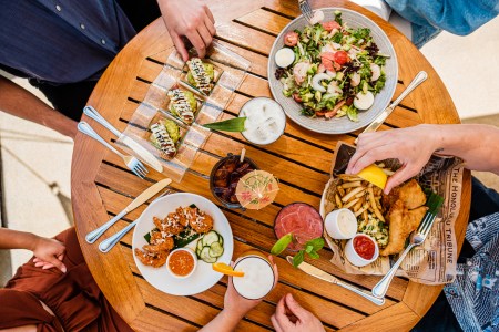 Birds-eye view of a table with plates of brunch food on it. Here are the best brunch spots in Malibu right now.