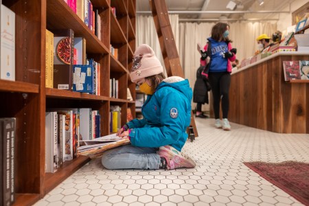 Neviana Racheva, 8, reads a book at Bold Fork Books in Washington, DC