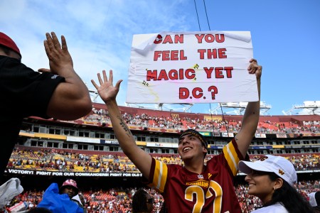 Commanders fan Logan Edwards celebrates after the game against the Arizona Cardinals at FedEx Field on September 10, 2023.