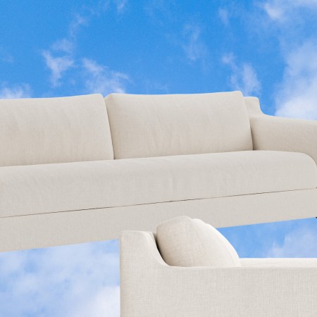 The Sabai Sleeper Sofa against a background of blue sky and clouds.